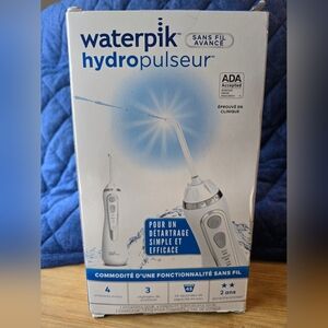 NIB Never Opened Cordless Waterpik Flosser